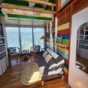 downstairs of one of the lofts with a sitting room, view of the colorful stairs